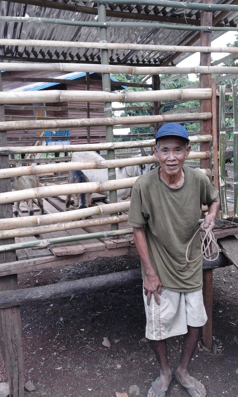 A participant in WEL’s Resilient Livelihoods for the Poor program poses with his newly acquired goats, a productive asset he will use to maintain a sustainable livelihood.