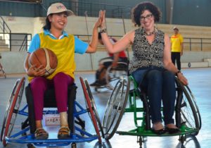 us ambassador high fives wheelchair basketball player