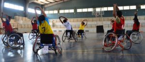 wheelchair basketball players warm up for the big game