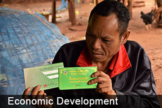 Economic development - man holds up documents